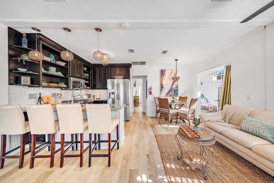 Open concept living room, dining room, kitchen spaces with easy view of adjoining reading nook. No matter where you are you can be included in the activities and conversation.