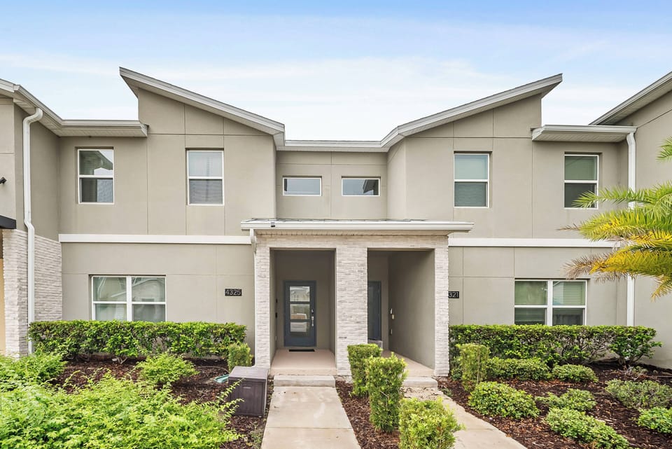 Welcome to your vacation home, where a charming exterior and warm colors invite you into a bright, airy retreat surrounded by lush greenery, designed for your ultimate comfort and relaxation. Enjoy your stay!