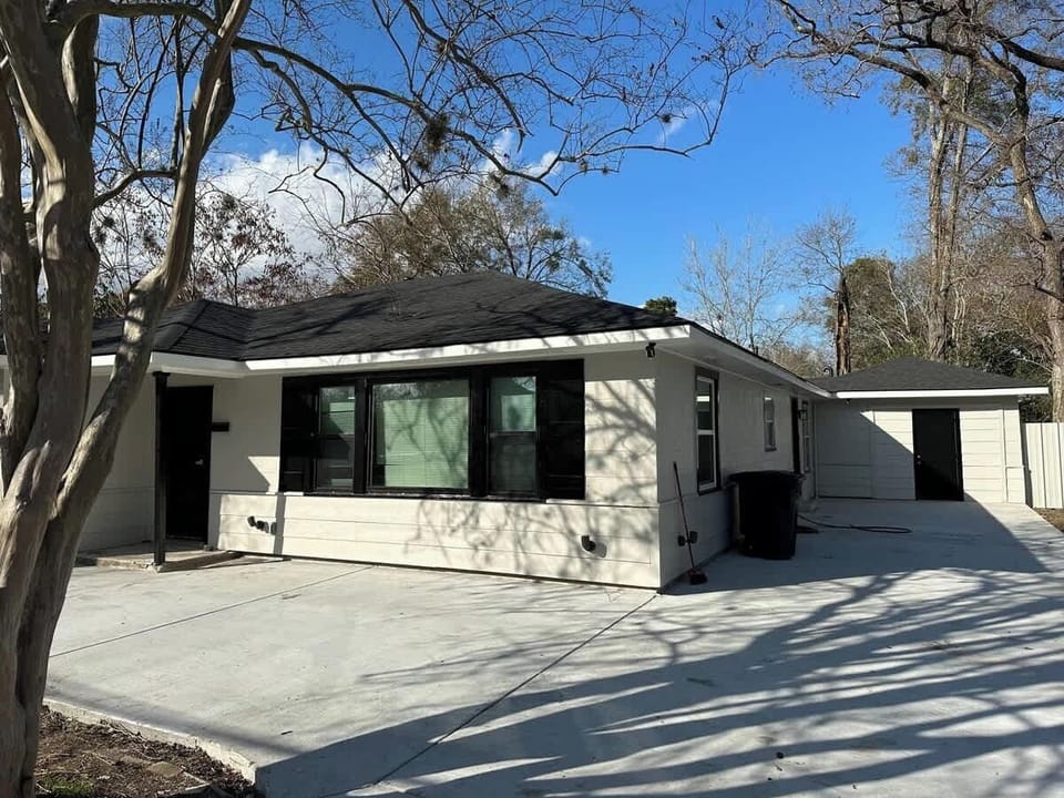 Front of the house with large driveway
