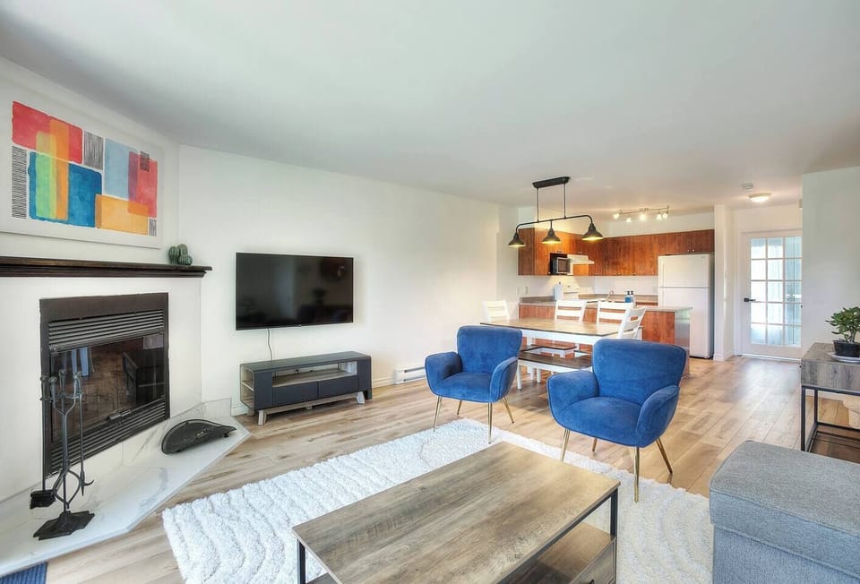 Full view of the main floor with a smart TV in the living room. 