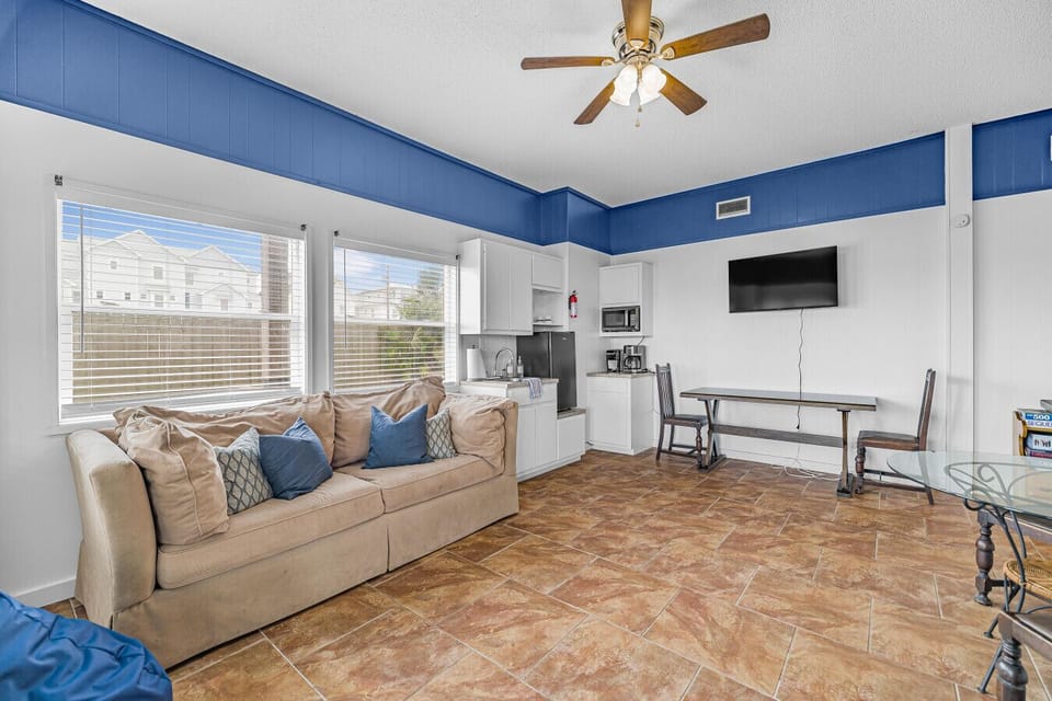 First-floor kitchenette and cozy living area — a convenient space for morning coffee, quick meals, and relaxing after a day on the water.