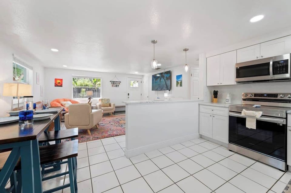 Bright and inviting living space with comfortable seating and Smart TV.