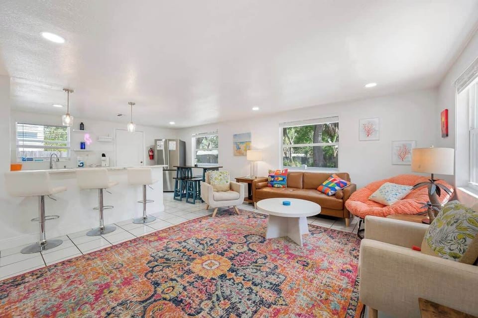 Bright and inviting living space with comfortable seating and Smart TV.
