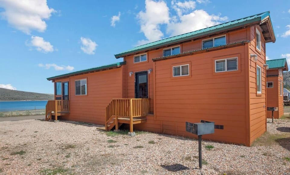 Enjoy a cozy cabin retreat surrounded by beautiful scenery and just moments from the lake.