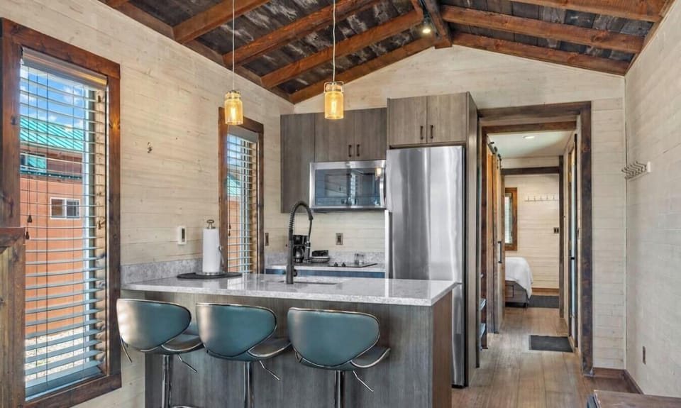 Prepare your favorite meals in the well-equipped kitchen, complete with a spacious island and bar seating.
