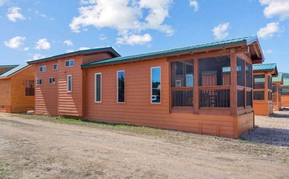 Take advantage of the spacious screened porch, offering a comfortable spot to enjoy the fresh air and beautiful surroundings.