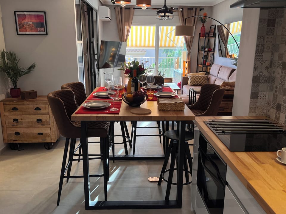 Dining area is spacious, comfortable, and easy access from the kitchen