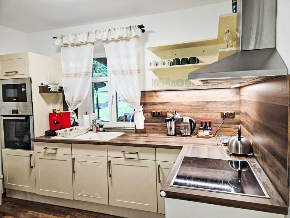 Kitchen Appliance, Kitchen, Furniture, Countertop, Cabinetry, Interior Design, Flooring, Wood, Major Appliance, Home Appliance