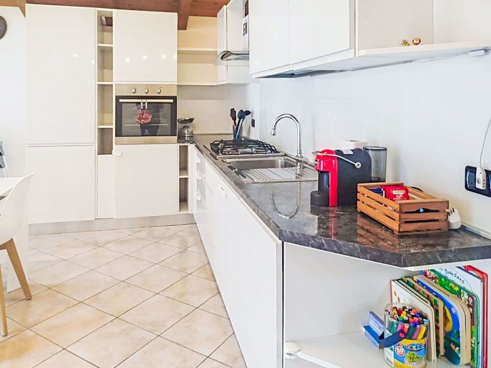 Kitchen, Kitchen Appliance, Interior Design, Flooring, Countertop, Major Appliance, Furniture, Wood, Floor, Cabinetry