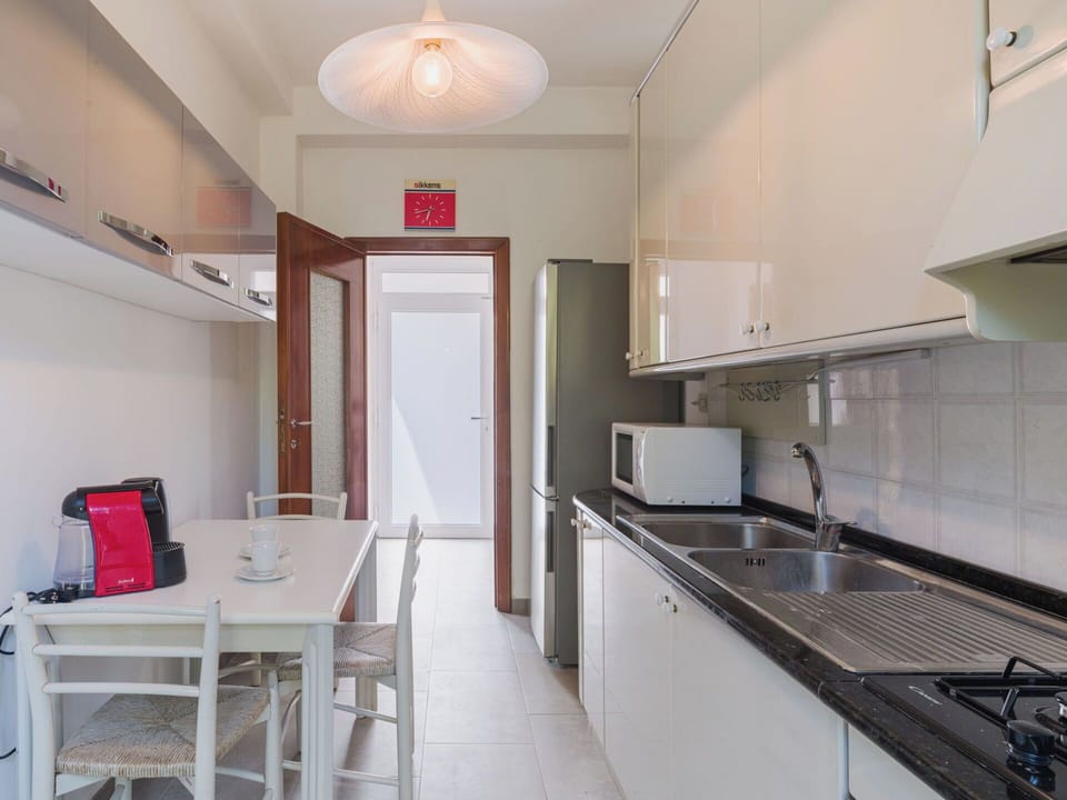 Kitchen, Flooring, Kitchen Appliance, Furniture, Interior Design, Major Appliance, Floor, Countertop, Wood, Ceiling