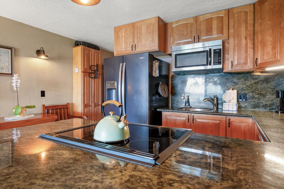 Prep dinner on granite counters with full-size appliances right at hand.