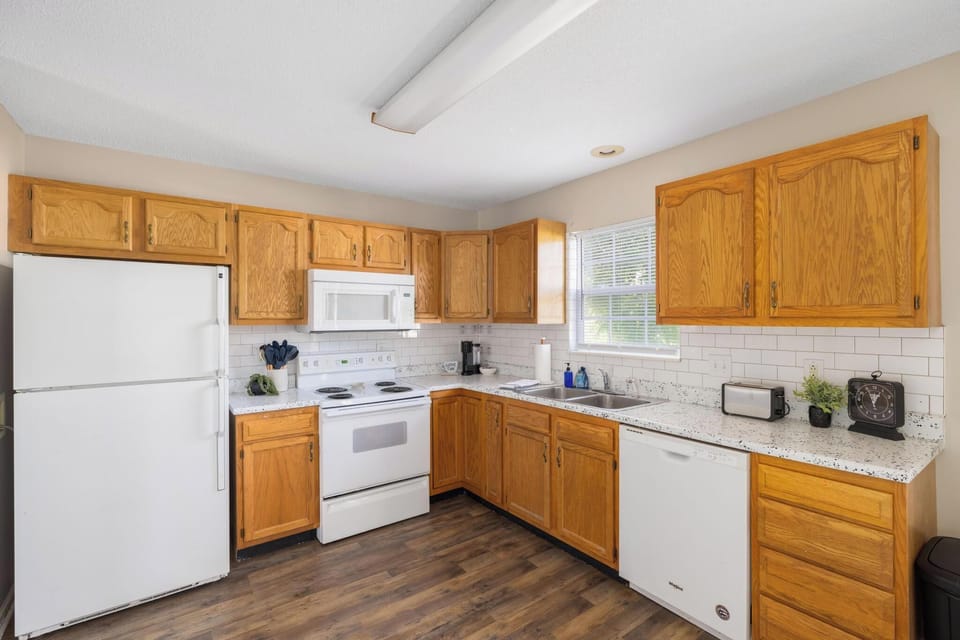 Bright kitchen with ample counter space and warm wood cabinetry