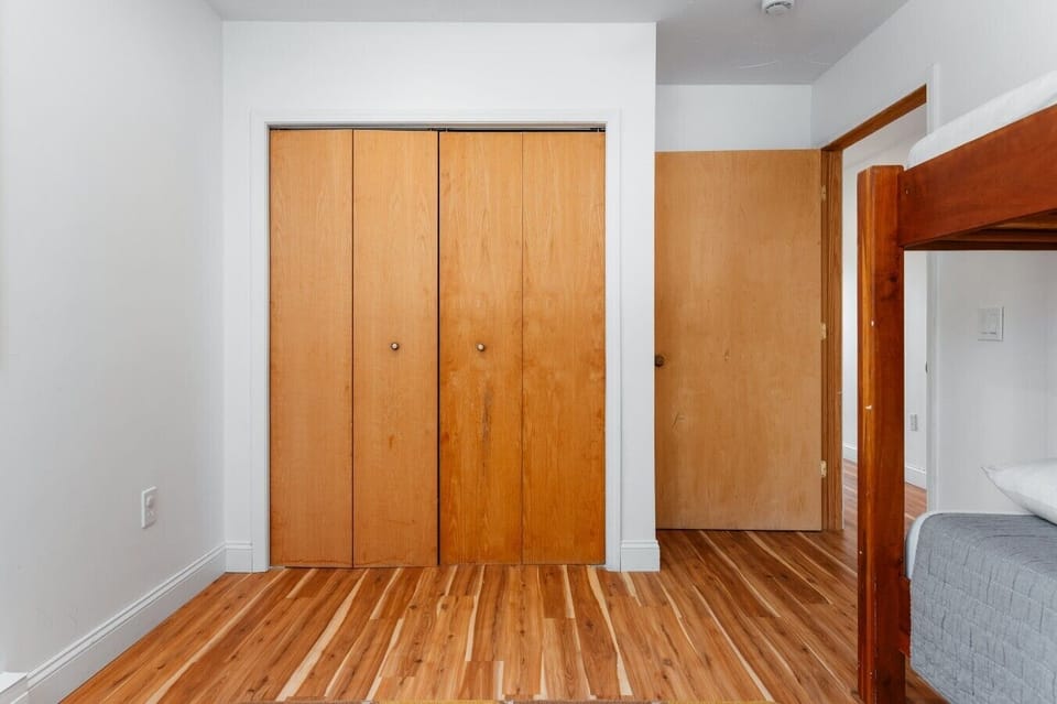 Beautiful wooden closet doors providing ample storage space! 🪵🚪✨