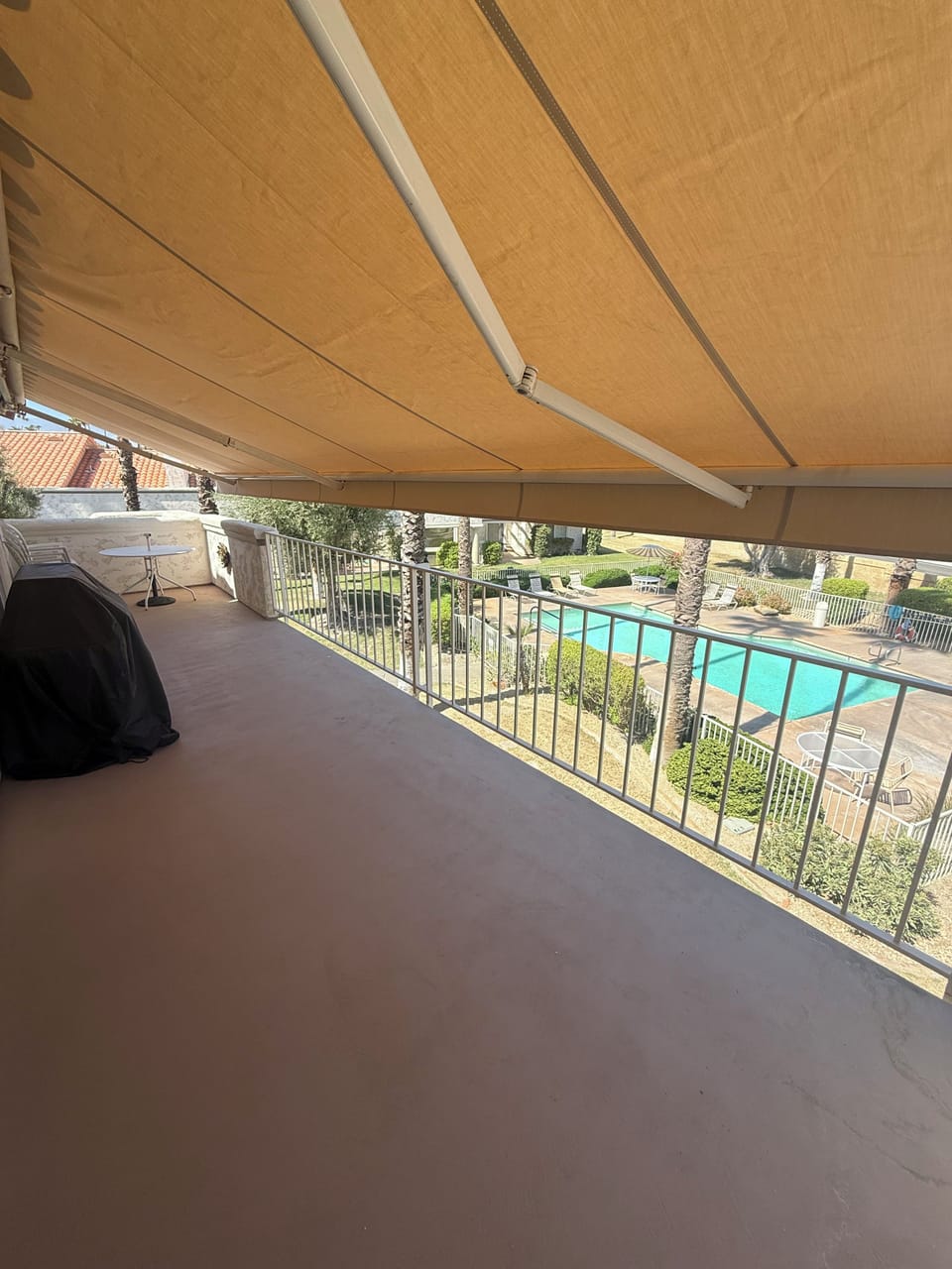 Motorized awning on the patio overlooking the pool area and Chocolate Mountains