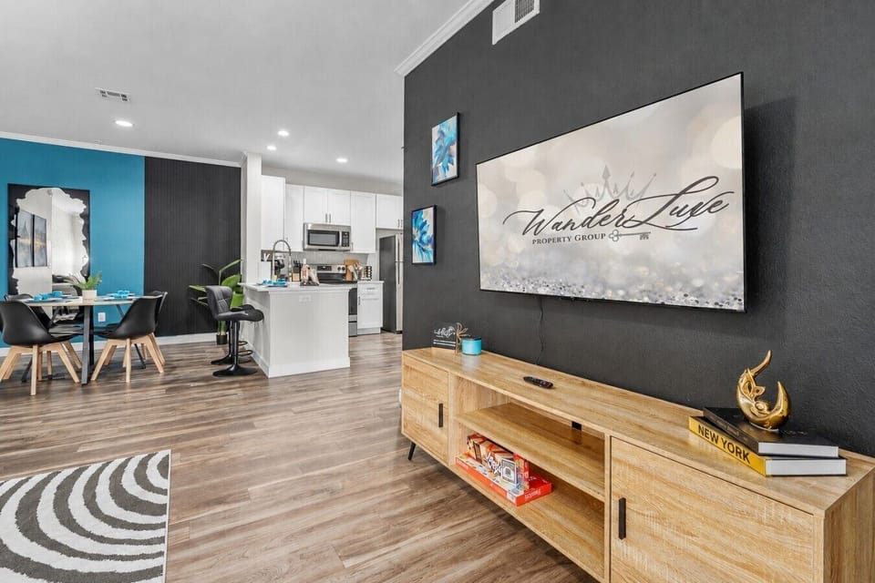 Sink into the plush couch and stream your favorites on the 55` 4K Smart TV.
