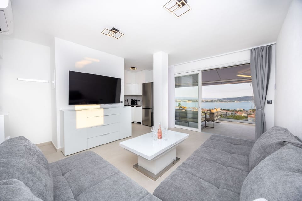 Elegant Living Room with TV,  sofa, kitchen on the rooftop floor