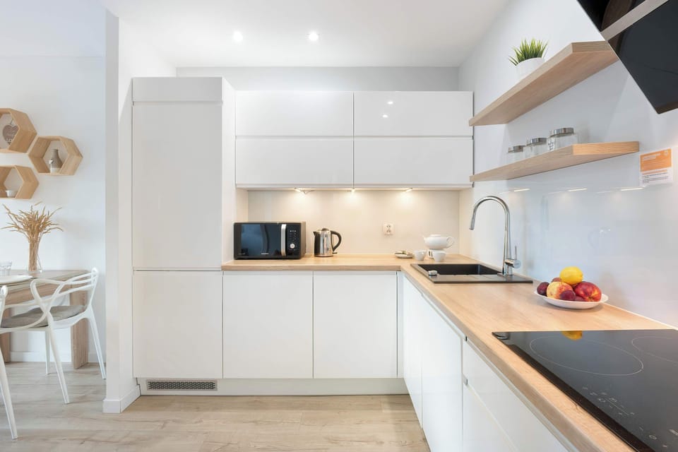 The fully equipped kitchenette includes everything you need for a home-cooked meal.