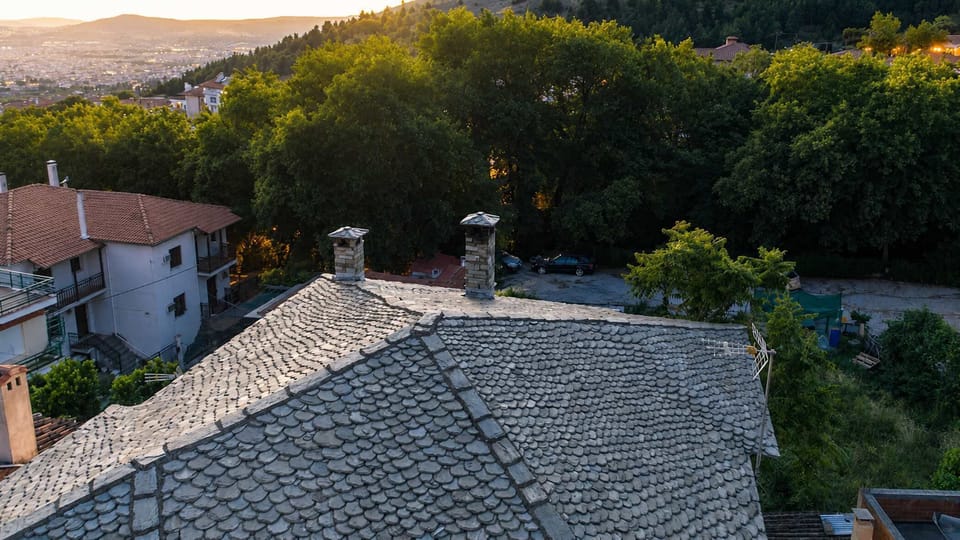 Peaceful views across the rooftops, trees and surrounding landscape.