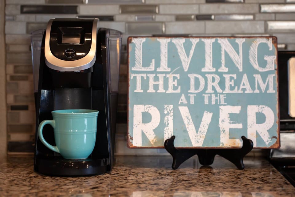 Bright, modern kitchen made for shared meals, morning coffee, and easy vacation cooking near the river.