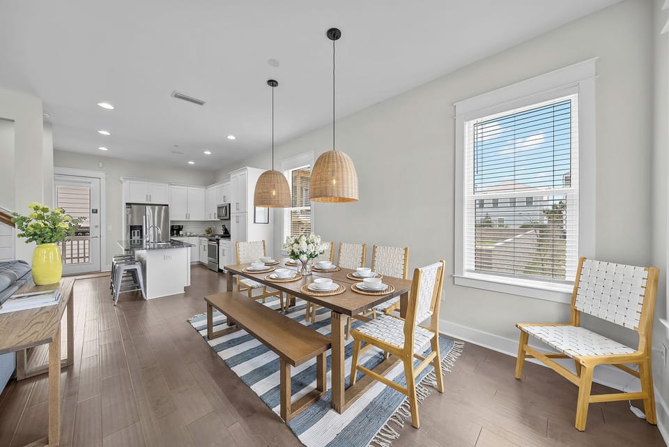 Seating for eight with the kitchen just behind, so serving a big meal never means crossing the house.