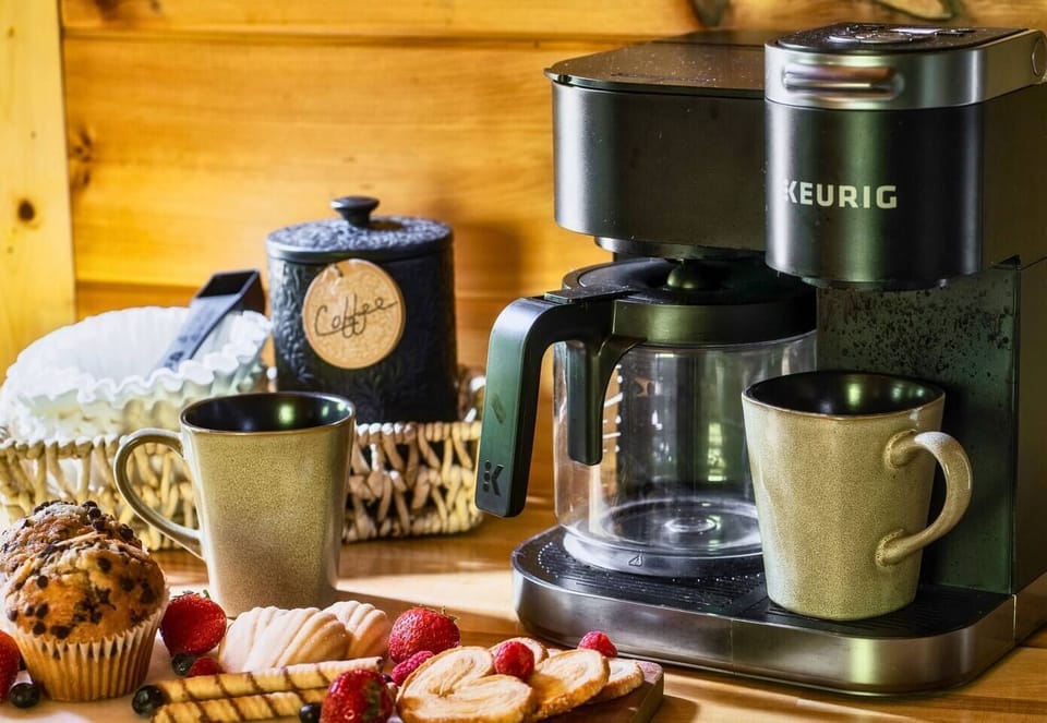 Enjoy breakfast with a view! This cabin offers everything you need to feel right at home, including a charming coffee station and cozy dining space.