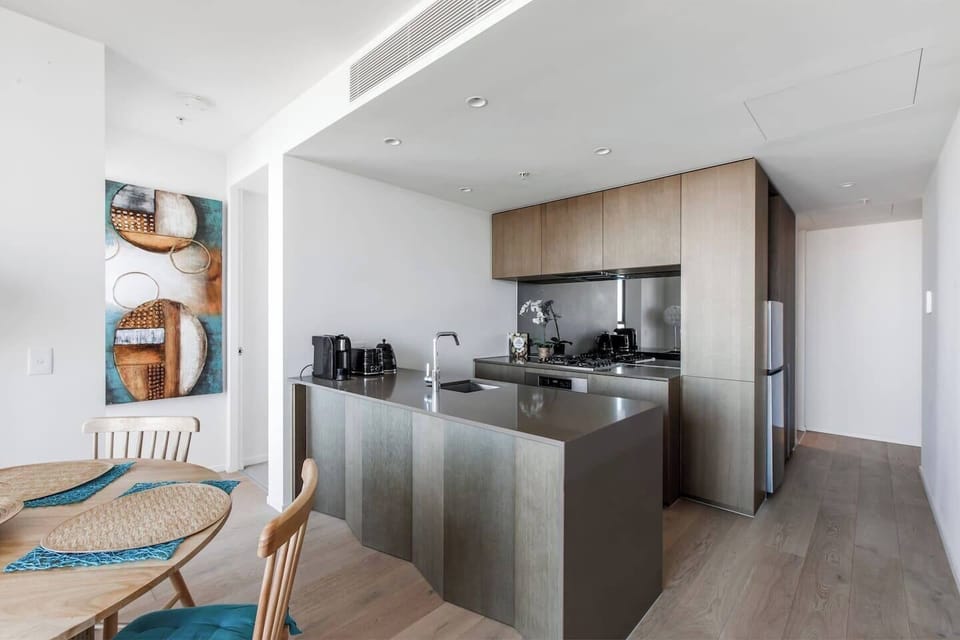 Whip up delicious meals in the well-appointed kitchen, featuring an oven, dishwasher, fridge, and microwave—designed for effortless cooking from breakfast to dinner.