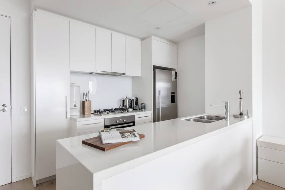 Prepare meals with everything at your fingertips, including a gas stove, oven, microwave, full-sized fridge, dishwasher, and cooking essentials all tucked into the modern kitchen.
