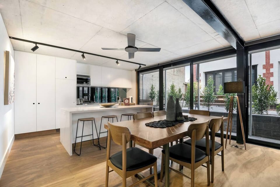 A six-seater timber table offers plenty of space to gather for a meal together at home.