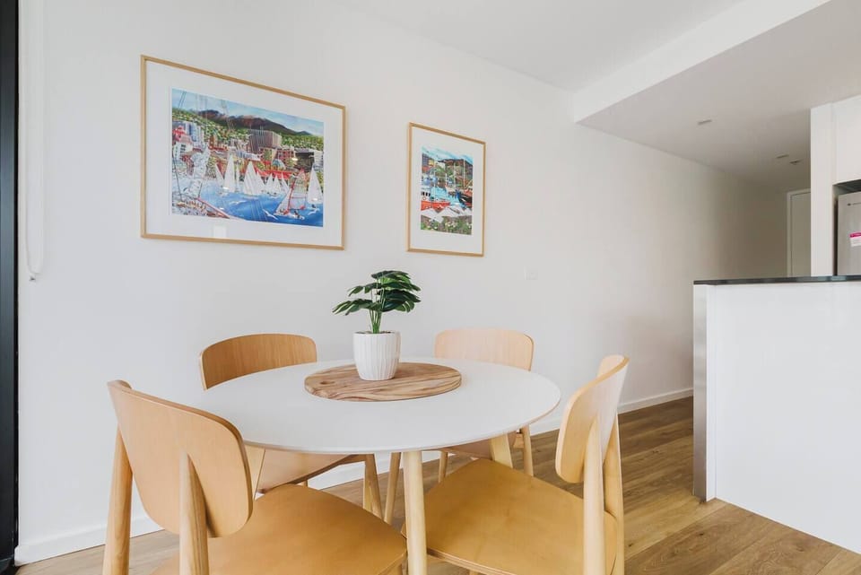 Enjoy meals together in the open-plan dining area, which includes a four-seater table.
