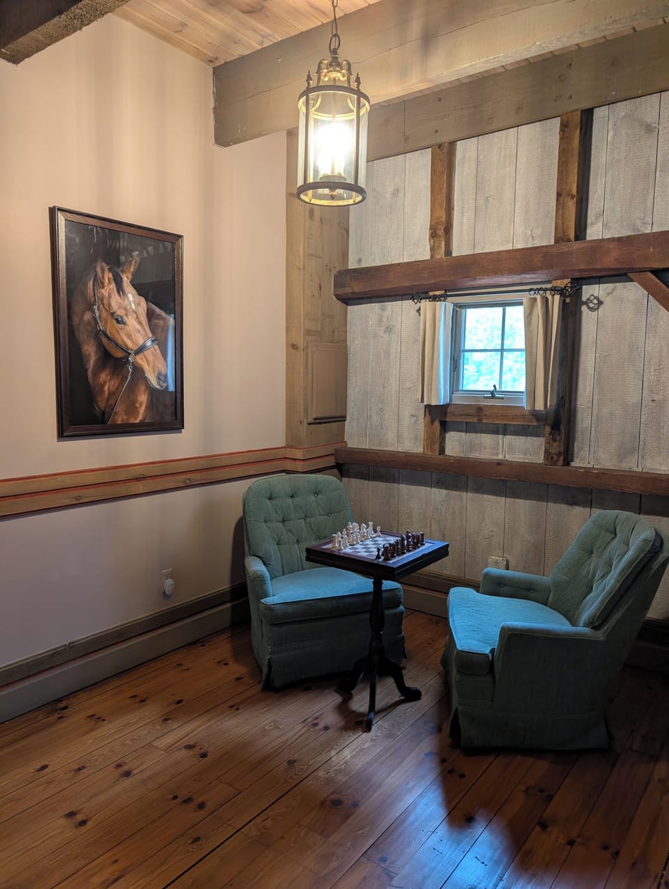 Cozy rustic reading nook with chess table and charming lodge details