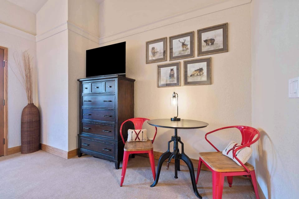 Bedroom 4: King bed, closet, refreshment nook with micro-fridge, shared balcony access, Samsung TV with basic cable
