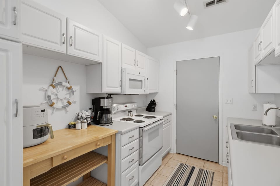 Fully equipped kitchen with butcher-block prep space