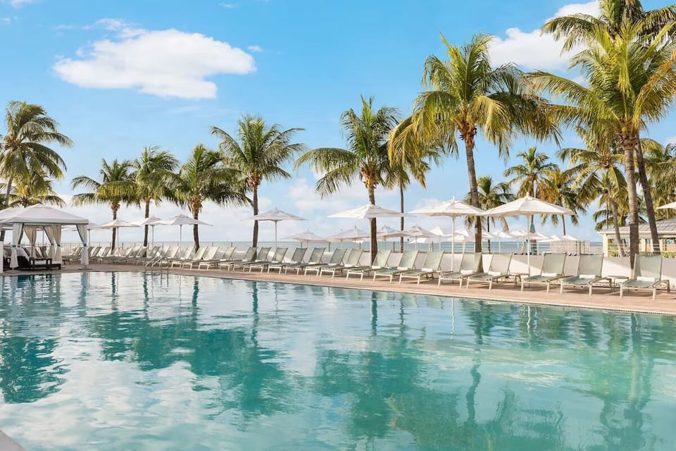 Stretch out by the sparkling pool with ocean breezes nearby.