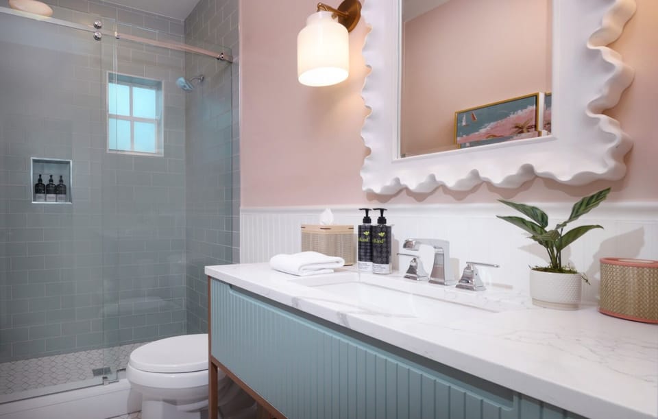 Start the day at a gleaming vanity with plush towels.