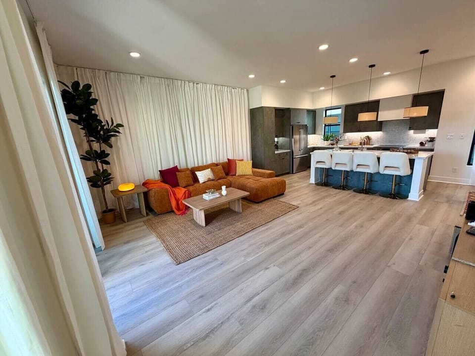 An open layout connects the kitchen, dining, and living areas into one easy space for gathering.