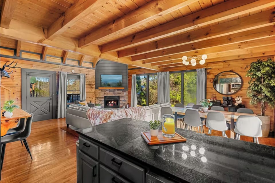Whether you're sharing stories after a day in the Smokies, enjoying a family movie night, or simply relaxing by the fire, this inviting great room is where memories are made.
