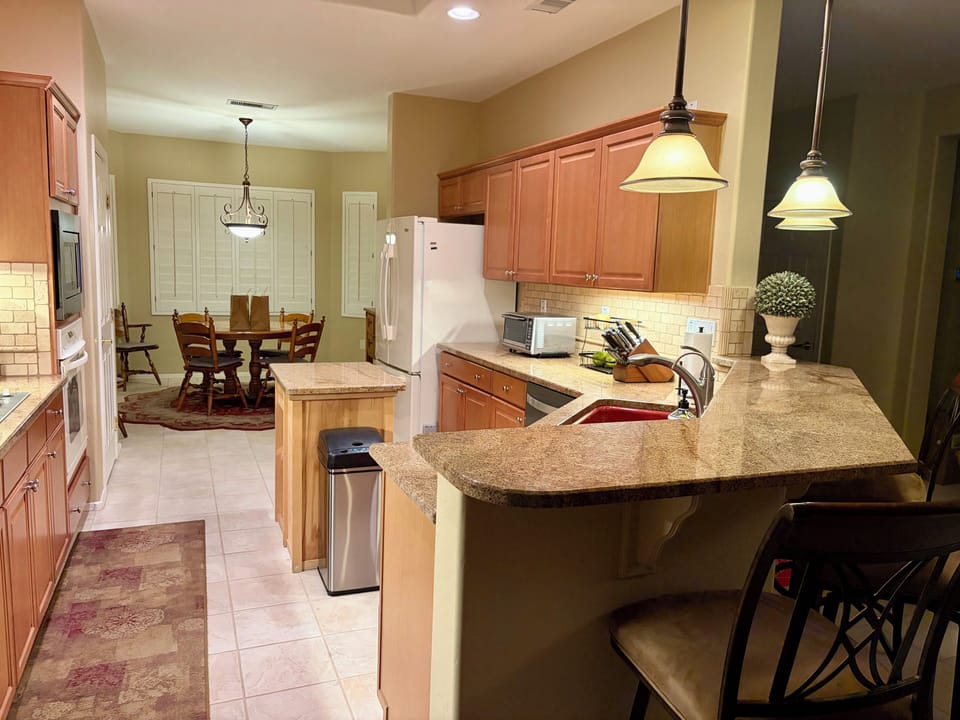 Spacious kitchen with island prep area 