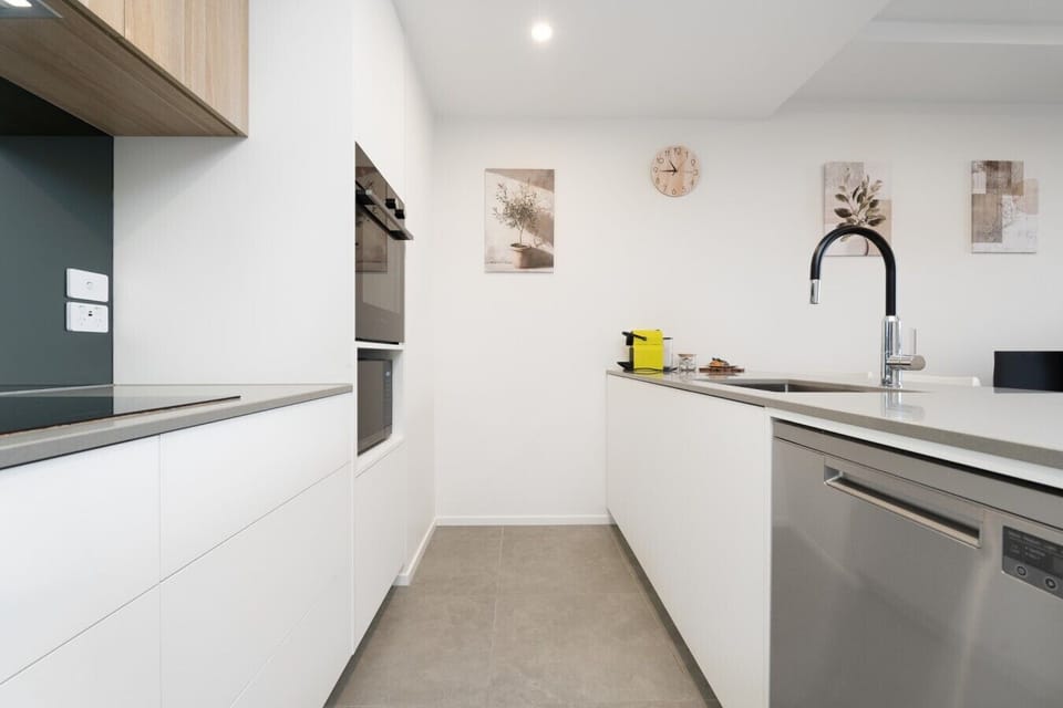 A sleek and well-appointed kitchen with modern finishes and plenty of space to prepare everything from a quick breakfast to a relaxed dinner.