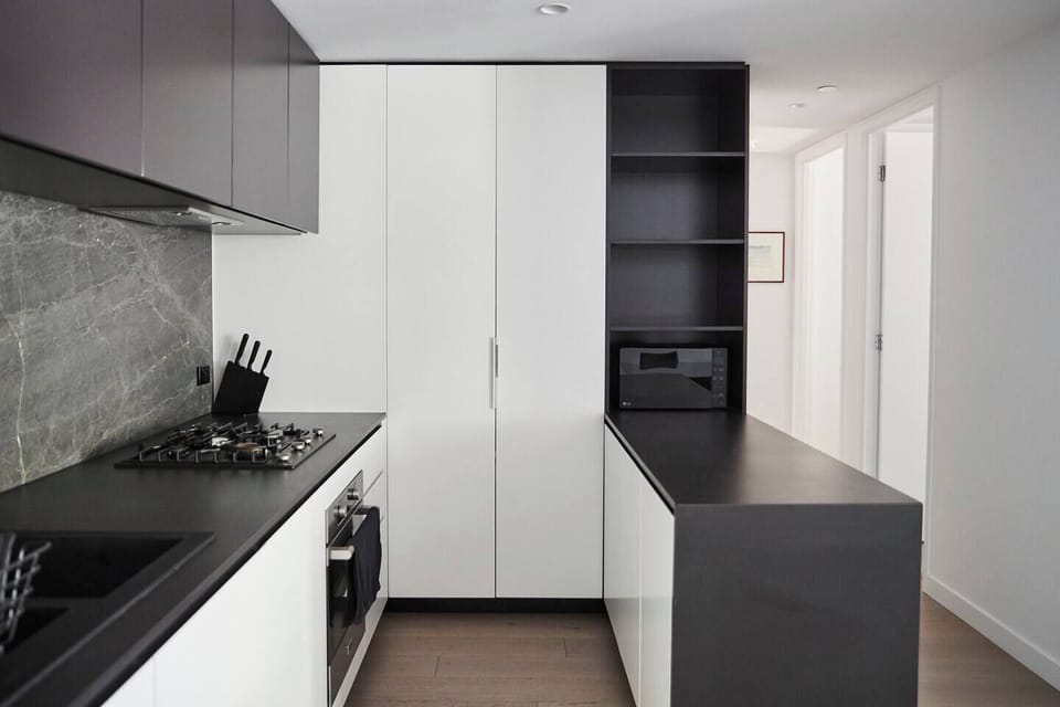 A modern culinary haven awaits you in the fully-equipped kitchen, boasting premium appliances and ample benctop space to inspire your inner chef.
