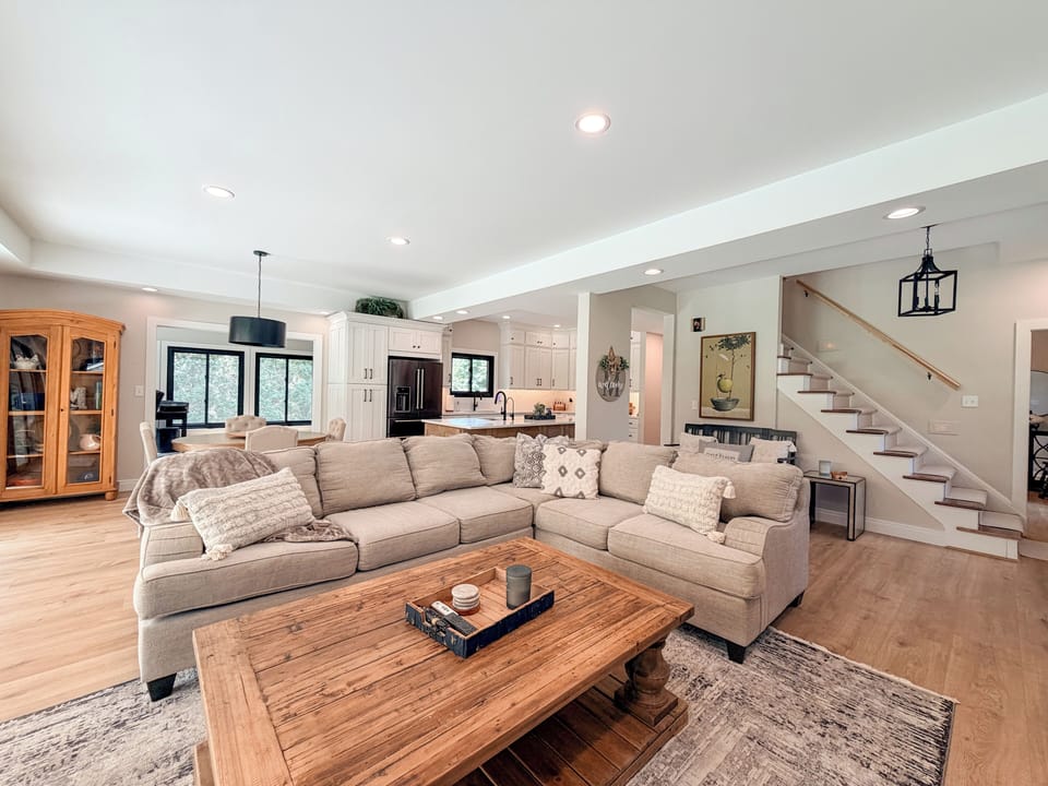 Open-concept living area with seamless access to the dining room and fully equipped kitchen.