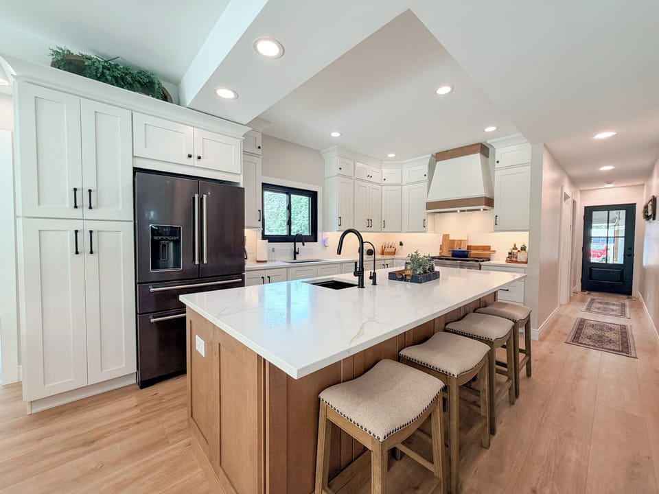 Fully equipped kitchen with an island and bar seating.