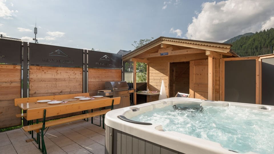 Rent a Hochfilzen vacation rental with barbecue area, hot tub, sauna cabin and outdoor space for families or group stays in Tyrol.