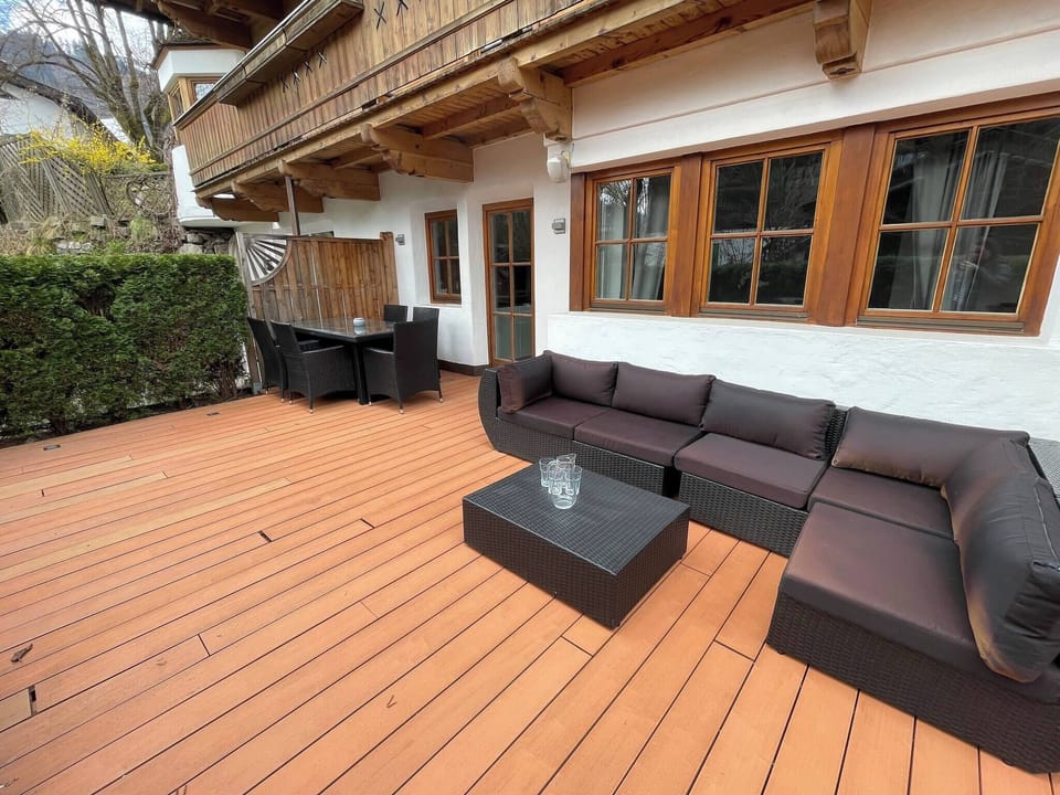 Book a Kitzbühel vacation apartment with spacious patio, seating area, quality interiors and location near Streif, old town and ski lift.