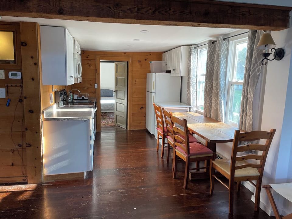 Kitchen into bedroom 1 of 2 bedroom barn apt
