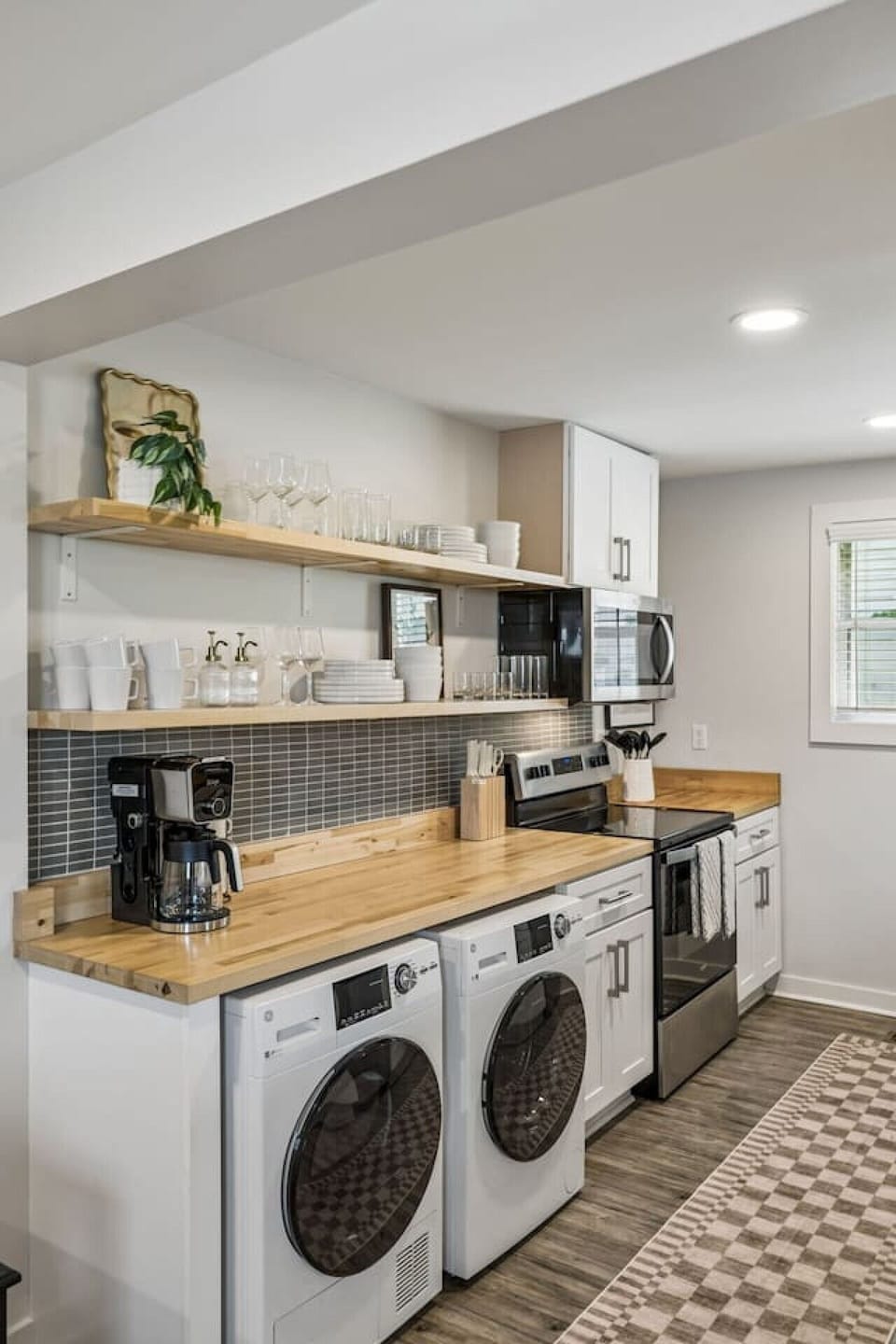 Open floor plan from the kitchen to living room. The kichen is equipped with all the essentials you would need, along with seating at the island high top.