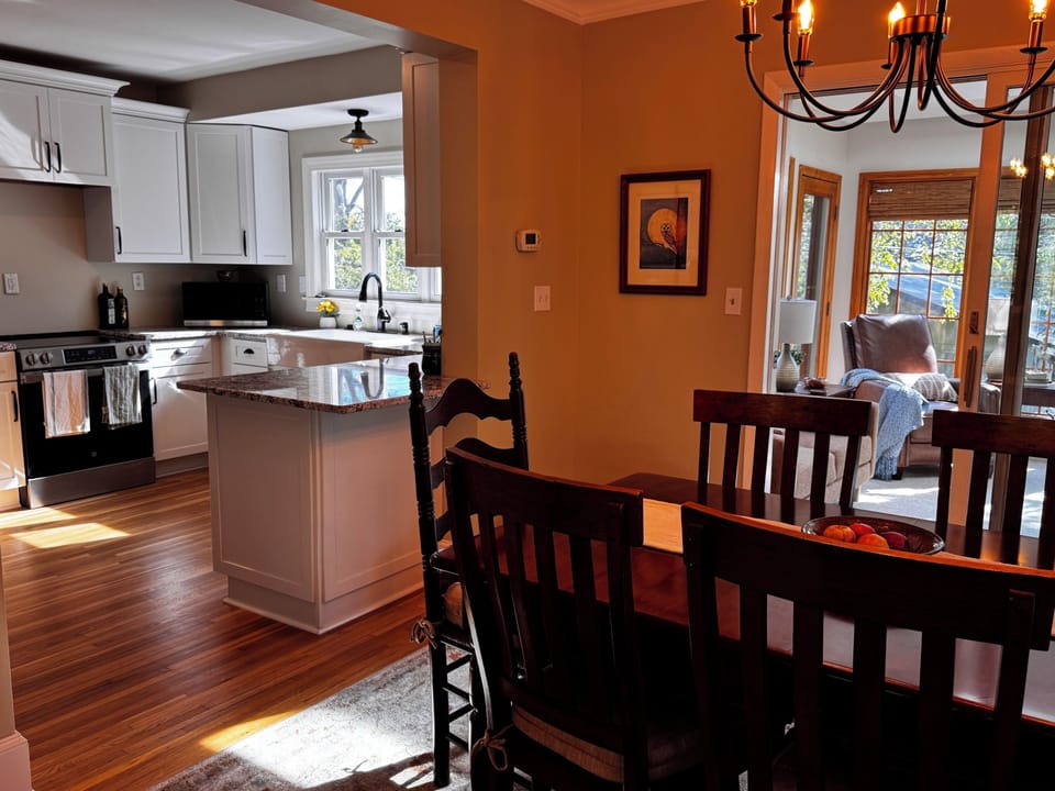 Dining room, sunroom in back, and kitchen to the left.