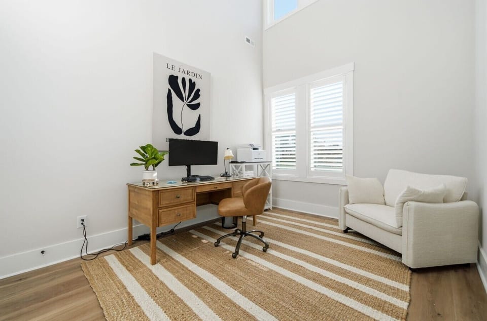 Dedicated workspace with a desk and comfortable seating—ideal for remote work or quiet planning