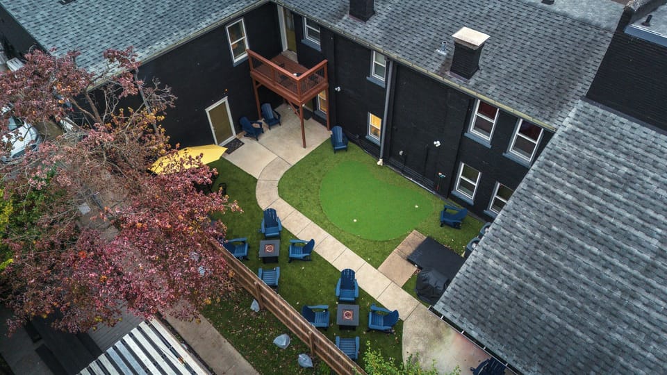 Private Courtyard: Putting green, balcony views, and cozy outdoor seating!