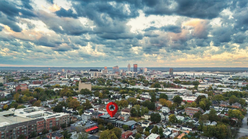 Aerial view with neighborhood charm and sweeping downtown skyline