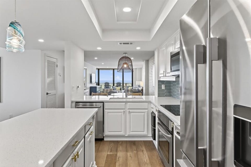 Open Kitchen Design with Gulf Views Beyond the Living Area